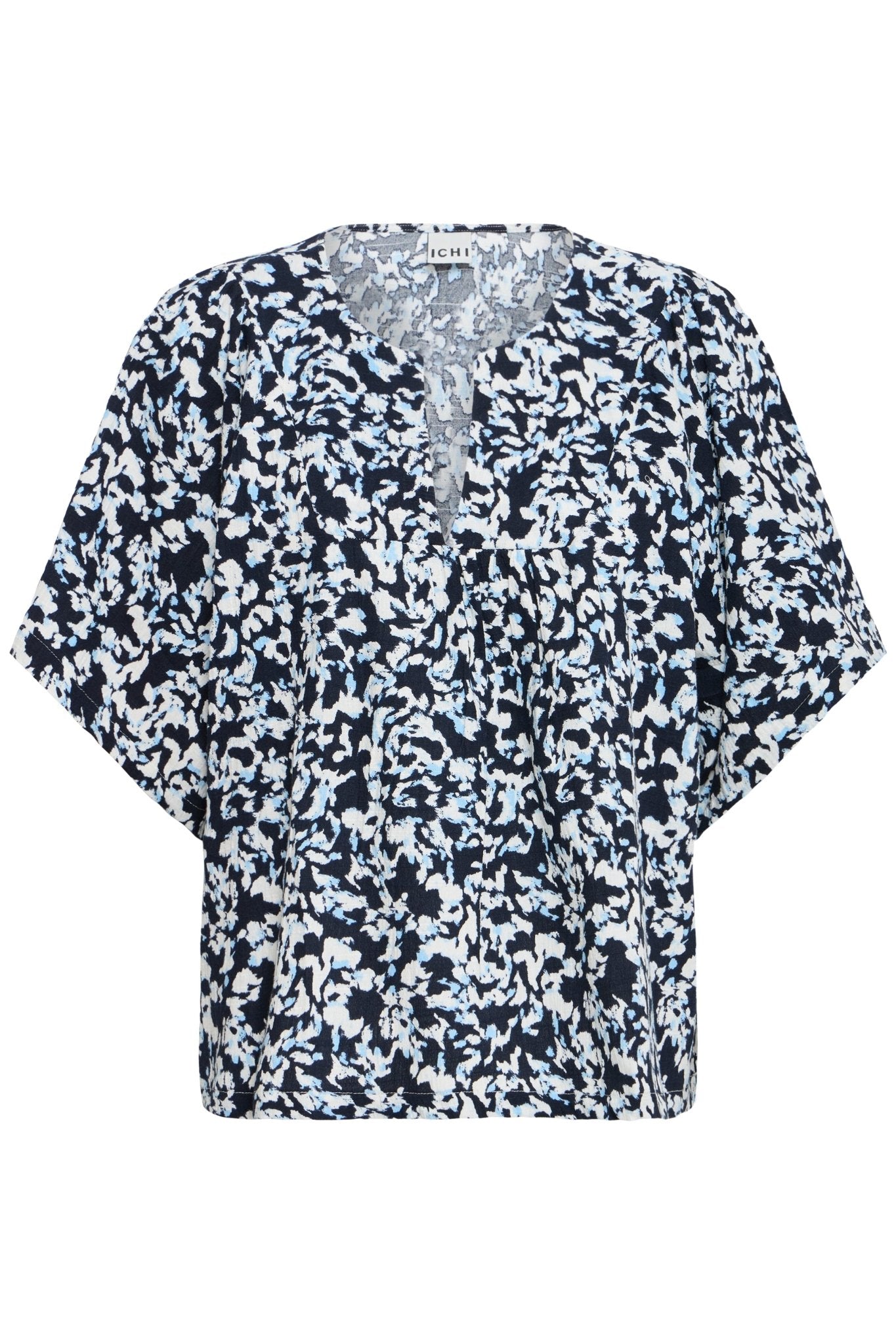 Bluse mit Muster und V - Ausschnitt in schwarz oder weiss - Blossom Hair & Fashion