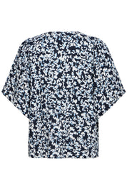 Bluse mit Muster und V - Ausschnitt in schwarz oder weiss - Blossom Hair & Fashion