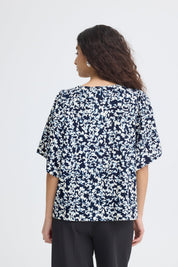 Bluse mit Muster und V - Ausschnitt in schwarz oder weiss - Blossom Hair & Fashion