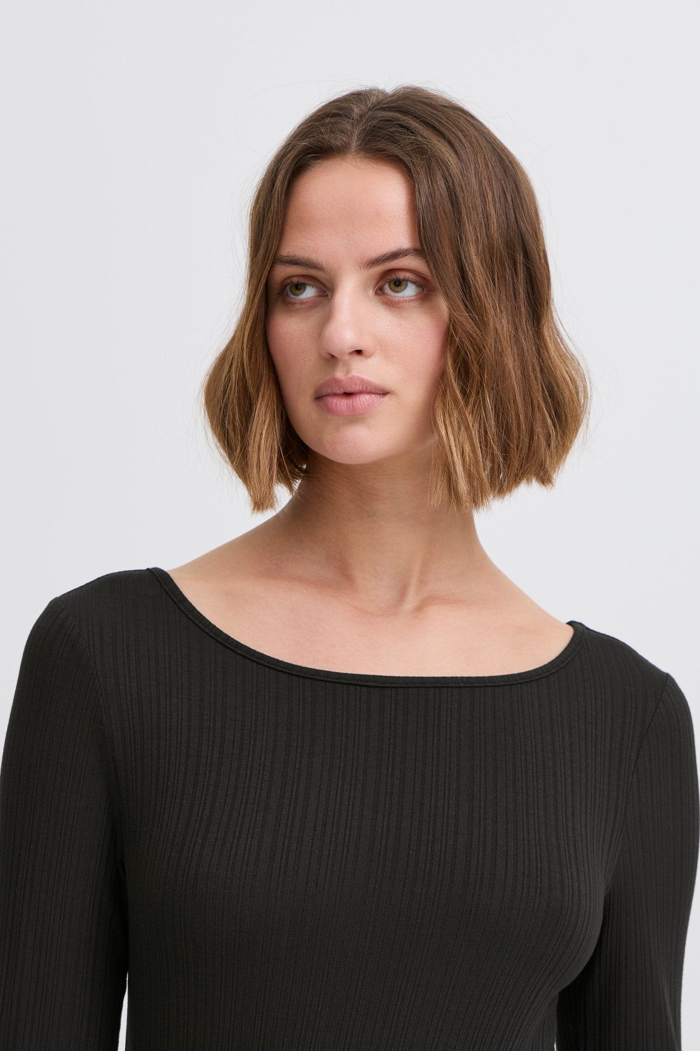 Langarmshirt gestreift in Schwarz oder Beige - Blossom Hair & Fashion