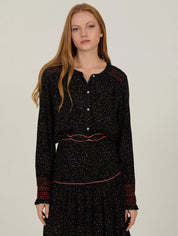 Schwarze Bluse mit Musterprint und feinen Details - Blossom Hair & Fashion