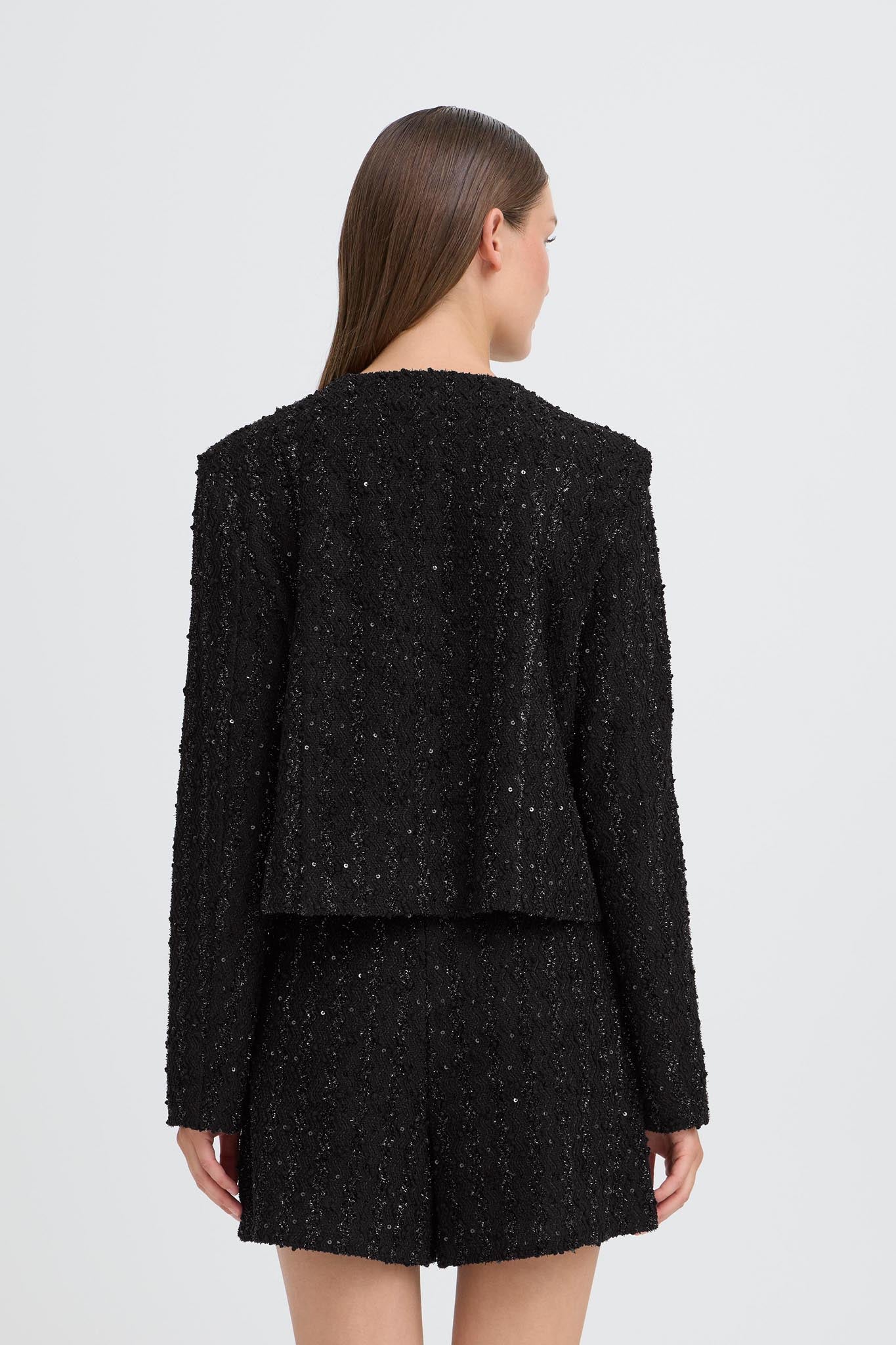 Schwarze Glitzerjacke mit strukturierter Oberfläche - Blossom Hair & Fashion