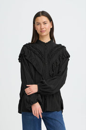 Schwarze Rüschenbluse mit Struktur - Blossom Hair & Fashion