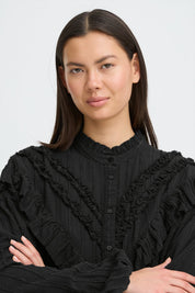 Schwarze Rüschenbluse mit Struktur - Blossom Hair & Fashion