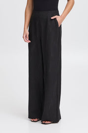Weite Hose in Schwarz mit feiner Struktur - Blossom Hair & Fashion